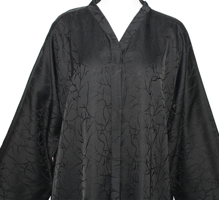 Abaya noire fluide avec un tissu