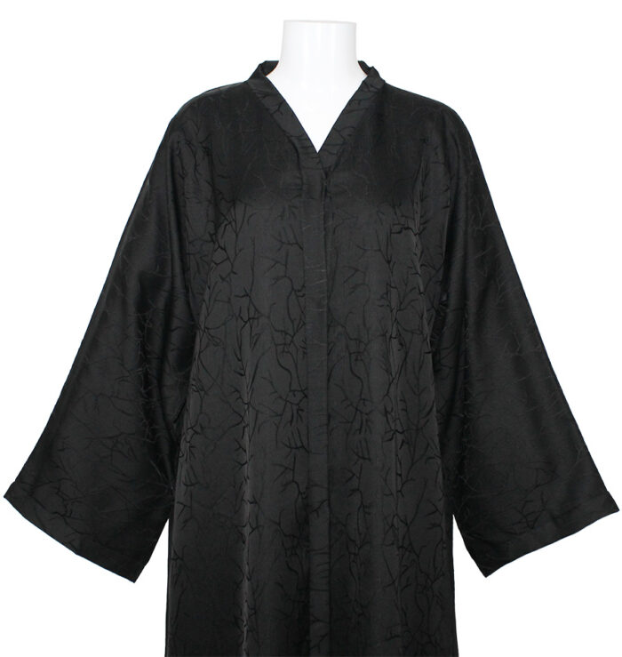 Abaya noire fluide avec un tissu